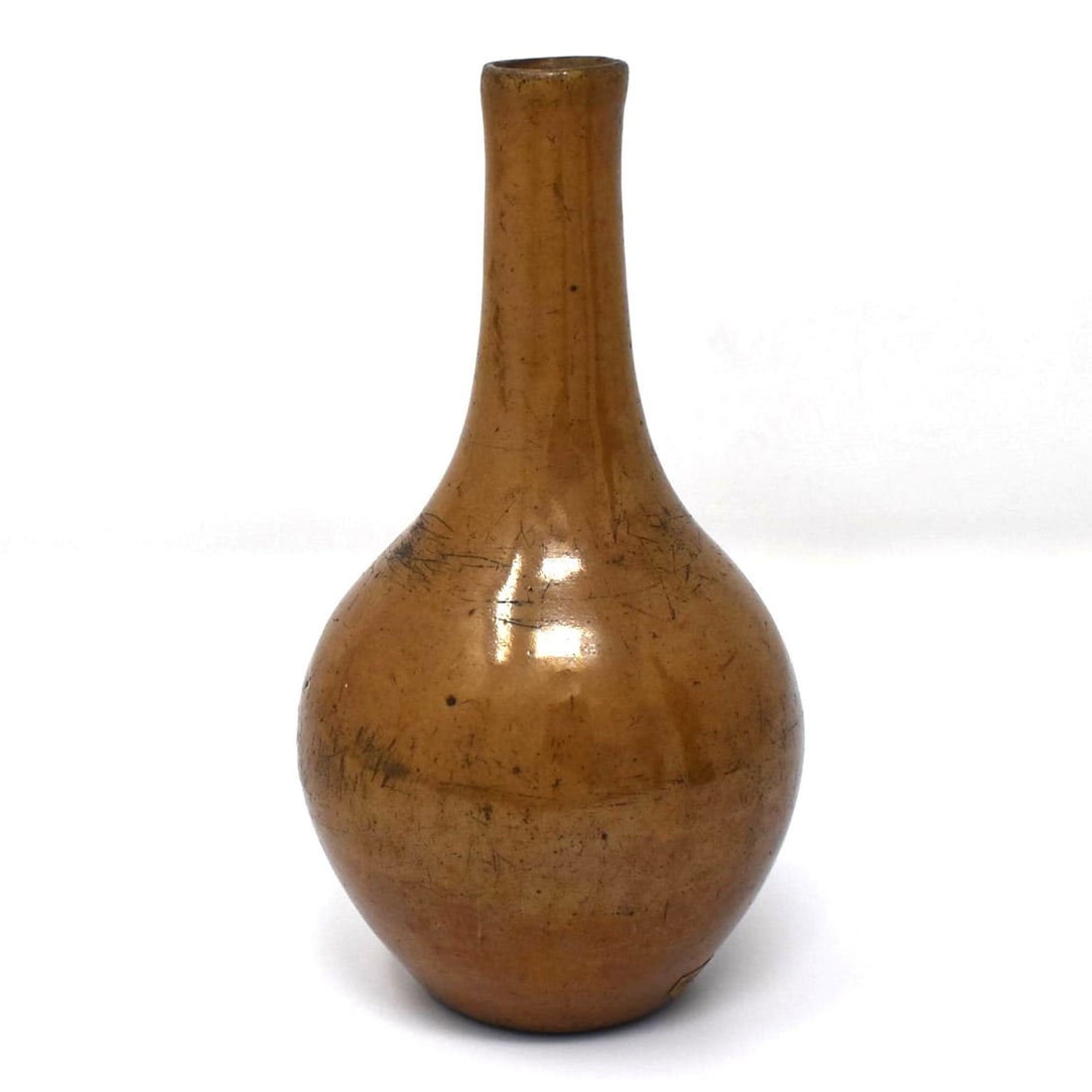 Chinese toffee-brown glazed bottle vase: A Chinese toffee-brown glazed bottle vase. From the Maria Anglesio collection, thence by descent to the present owner. Approximate measurements: 6"h x 3" in diameter or 15.2cm h x 7.6 cm in diameter