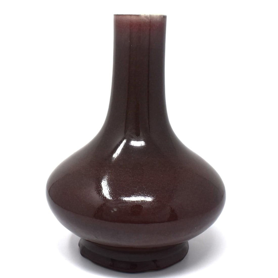 A Chinese copper-red glazed bottle vase, Qing Dynasty (1 of 15)