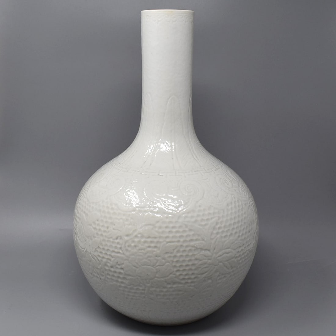 A  Chinese white-glazed carved bottle vase, Qing Dynasty (1 of 20)