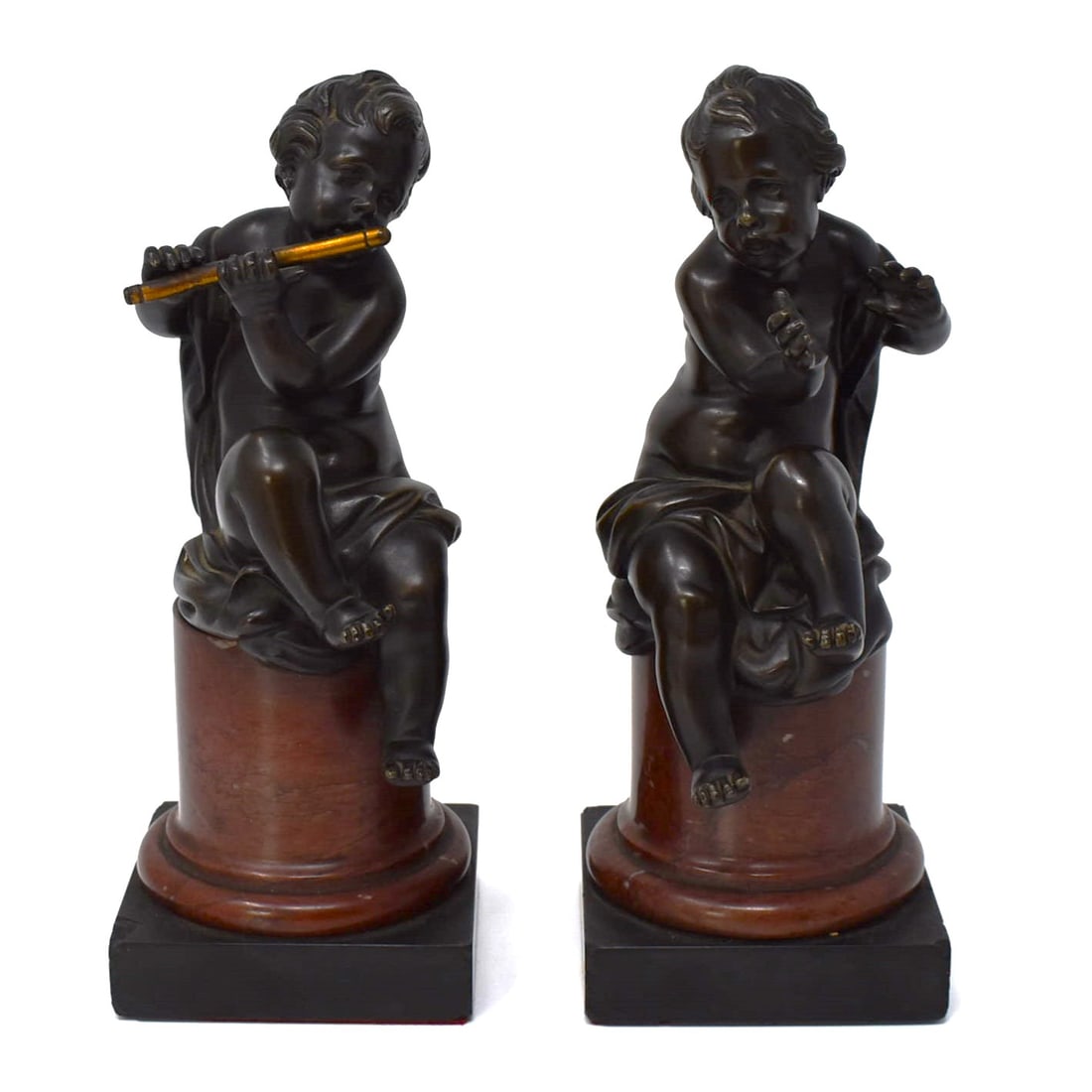 Pair of antique French patinated bronze musical cherubs/ putti on rouge marble plinths: Pair of antique French patinated bronze musical cherubs/ putti on rouge marble and black Belgian marble plinths. Late 19th century. Apparently un-marked. One cherub missing his instrument. Approximate