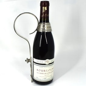A rare Victorian sterling silver wine bottle holder / pourer