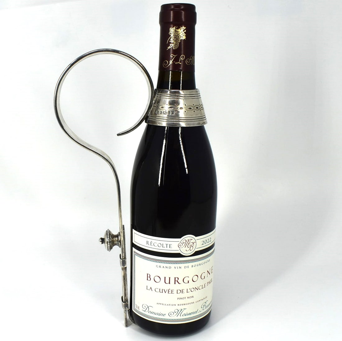 A rare Victorian sterling silver wine bottle holder / pourer: A rare Victorian sterling silver adjustable wine bottle holder / pourer, chased with vine motif, Sheffield silver hallmarks for 1884 and maker's marks of William Hutton and Sons (Edward Hutton). Weigh