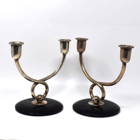 A pair of Art deco continental silver candlesticks on wood base