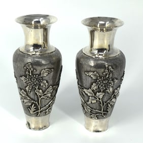 A small pair of antique Chinese silver vases