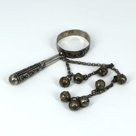 An antique silver & niello baby rattle with bells