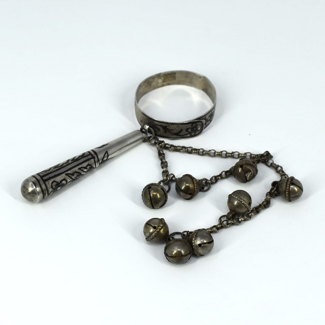 An antique silver & niello baby rattle with bells: An antique silver and niello baby rattle with bells, the wrist band adjustable. No apparent hallmarks but tested and guaranteed to be silver of at least 800/1000 purity. Possibly Ottoman/ Turkish. Ori