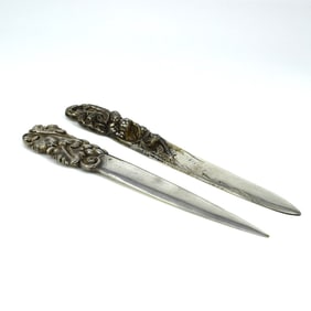 Two antique French silverplated brass letter openers. Signed