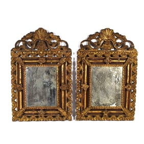A pair of antique continental giltwood mirrors