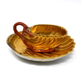 Antique or Vintage Shell-shaped cup and saucer after Pierre Louis Dagoty
