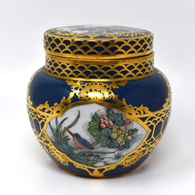 A gilt overlay famille verte style porcelain jar and cover