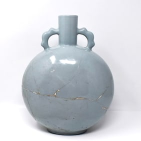 A large Chinese light-blue glazed moonflask-form vase