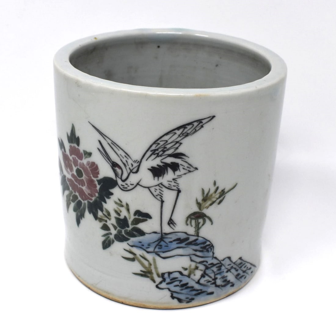 A Chinese porcelain brushpot with crane: A Chinese porcelain brushpot with crane, the base inscribed with marks in underglaze blue. From a Delaware estate Approximate measurements: 4 3/4"H x 4 3/4" in diameter or 12cm h x 12cm in diameter