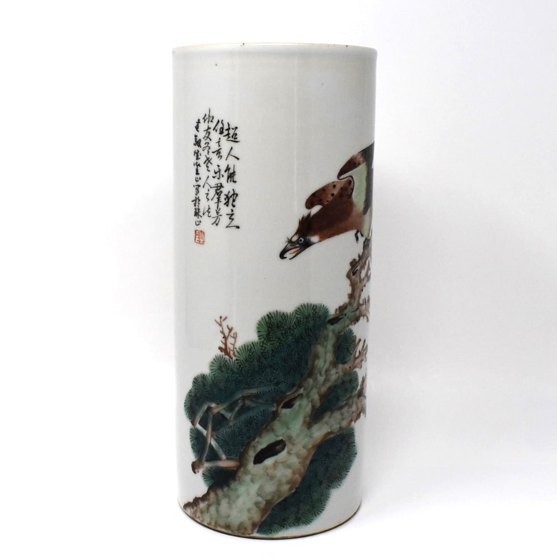 A Chinese famille rose porcelain hat stand with bird of prey: A Chinese famille rose porcelain hat stand with bird of prey atop a pine tree. Stamped with an iron red octogonal mark on the underside. From a Delaware estate Approximate measurements:11 1/4"H x 4 3/