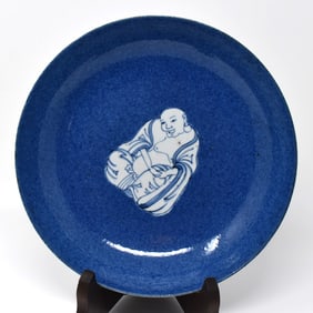 A Chinese powder-blue-ground blue & white 'Budai' dish
