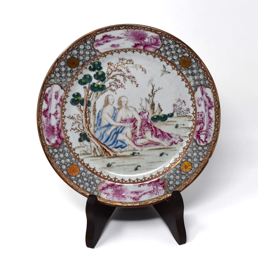 A Chinese export famille rose porcelain plate, 18th cent.: An 18th century Chinese export famille rose porcelain plate depicting a classically drapped couple, possibly Adam and Eve. Approximate measurements: 9" in diameter or 23cm in diameter
