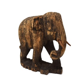 An antique / vintage Asian carved wood elephant sculpture