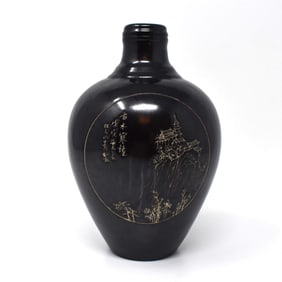 A Chinese black-glazed carved porcelain vase