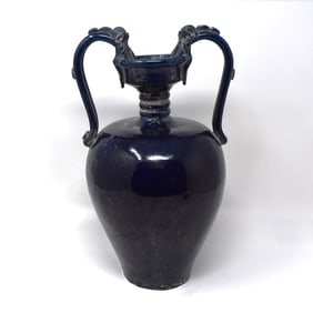 A Chinese blue-glazed ceramic vase with dragon-form handles