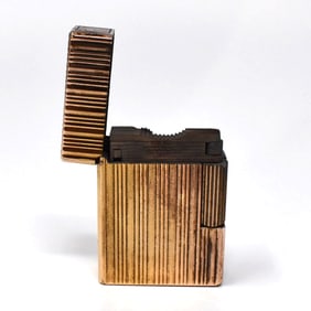 A vintage S.T. Dupont gold-plated lighter