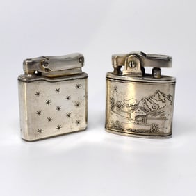 Two vintage lift-arm lighters