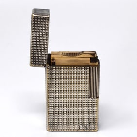 A vintage S.T. Dupont silver finish lighter