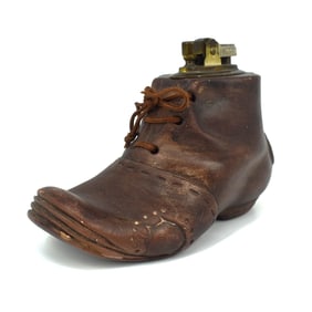 A vintage Novelty shoe-form table lighter