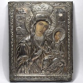 An antique icon of the the Mother of God with silver oklad