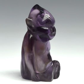 Attributed to CARTIER, a carved purple stone Billiken figure