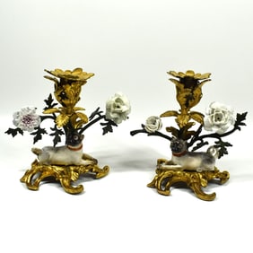 A pair of Meissen pugs mounted on gilt-bronze candelabra circa 1745-1750