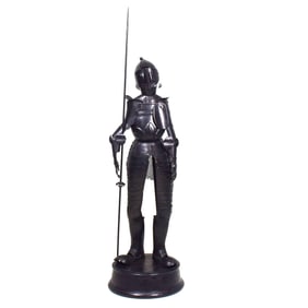 An articulated medieval armor model on stand