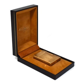 A vintage S.T. Dupont Gold-plated lighter in original case