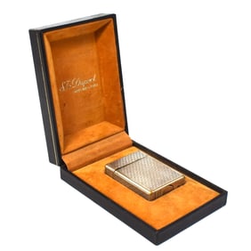 A vintage S.T. Dupont silver-plated lighter in original case