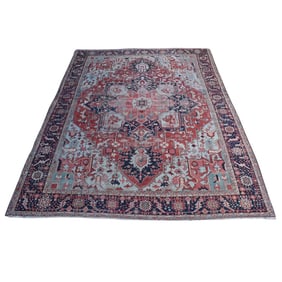 An antique Persian Heriz Serapi room size rug