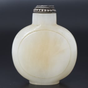 A Chinese carved white jade snuff bottle