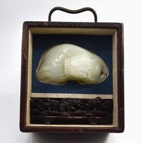 A Chinese jade carving of mythical beast in custom wood box