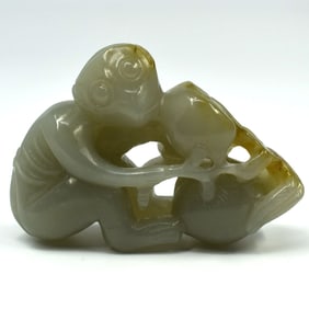 A small Chinese carved jade group with monkey