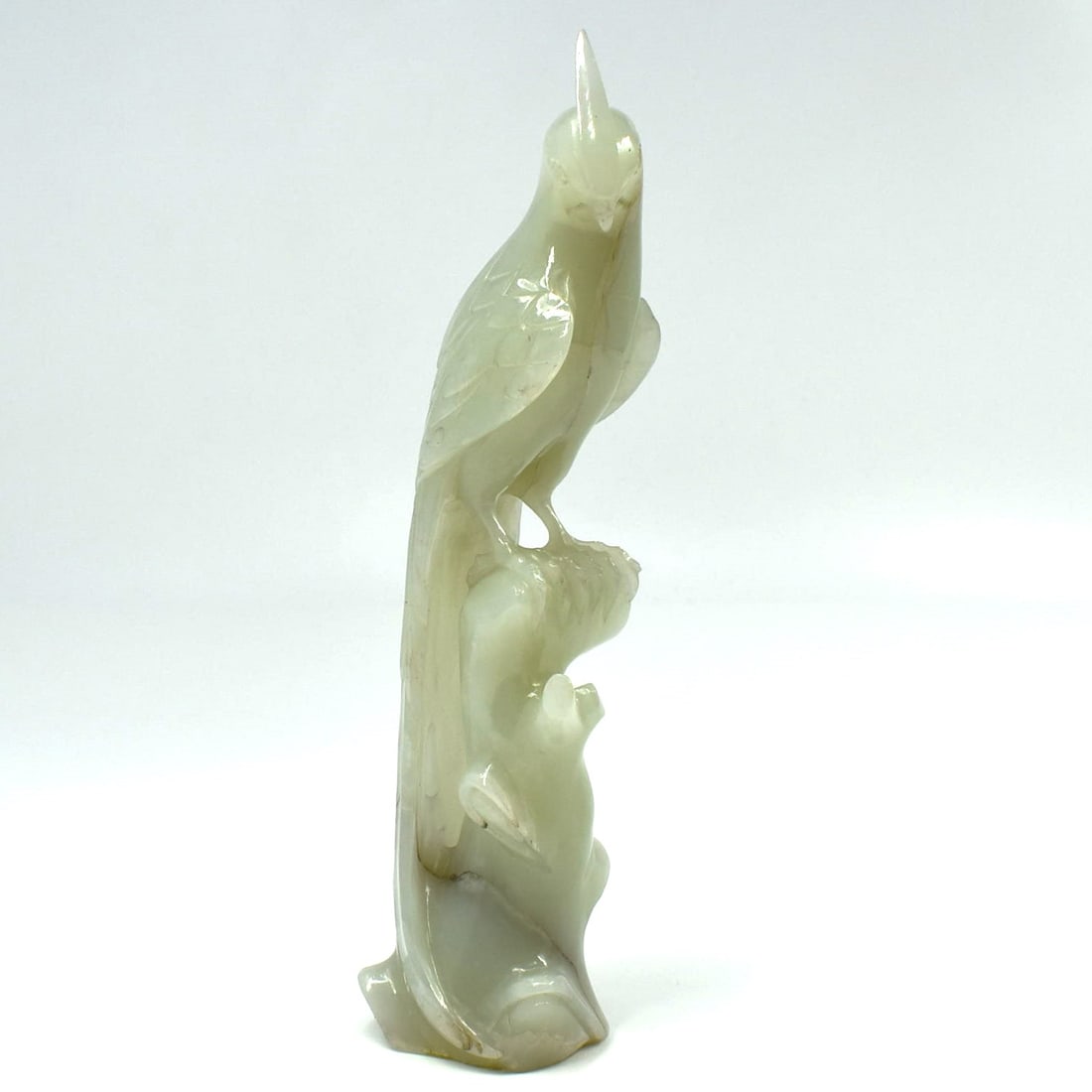 A Chinese jade carving of bird on stump (1 of 16)