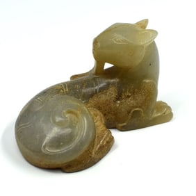 A Chinese carved jade reclining tiger/beast