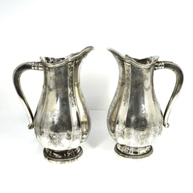 A pair of GHISO solid .950 silver water jugs