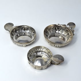 A grouping of three French sterling silver tastevin wine cups