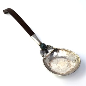 A large vintage Mexican sterling silver and wood serving spoon
