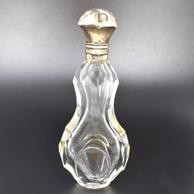 An antique silver mounted glass perfume bottle/ scent bottle