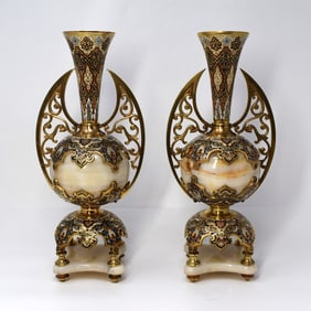 An unusual pair of French champleve enamel, ormolu mounted onyx vases