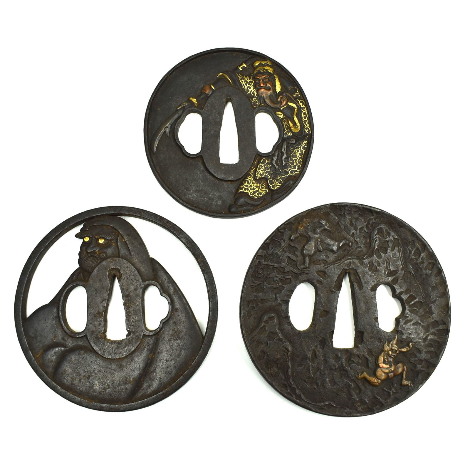 A grouping of three Edo period iron Tsubas featuring demons (1 of 7)
