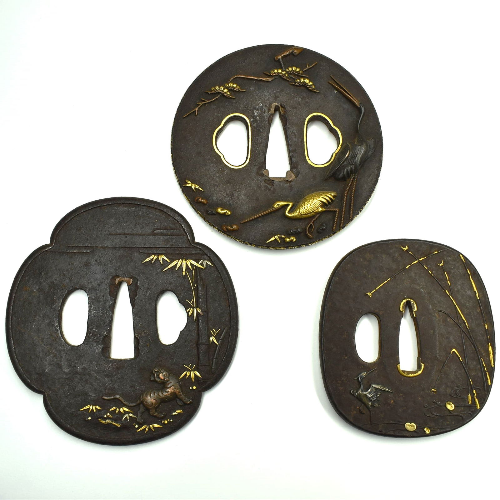 A grouping of three Edo period iron Tsubas featuring cranes and a tiger (1 of 8)