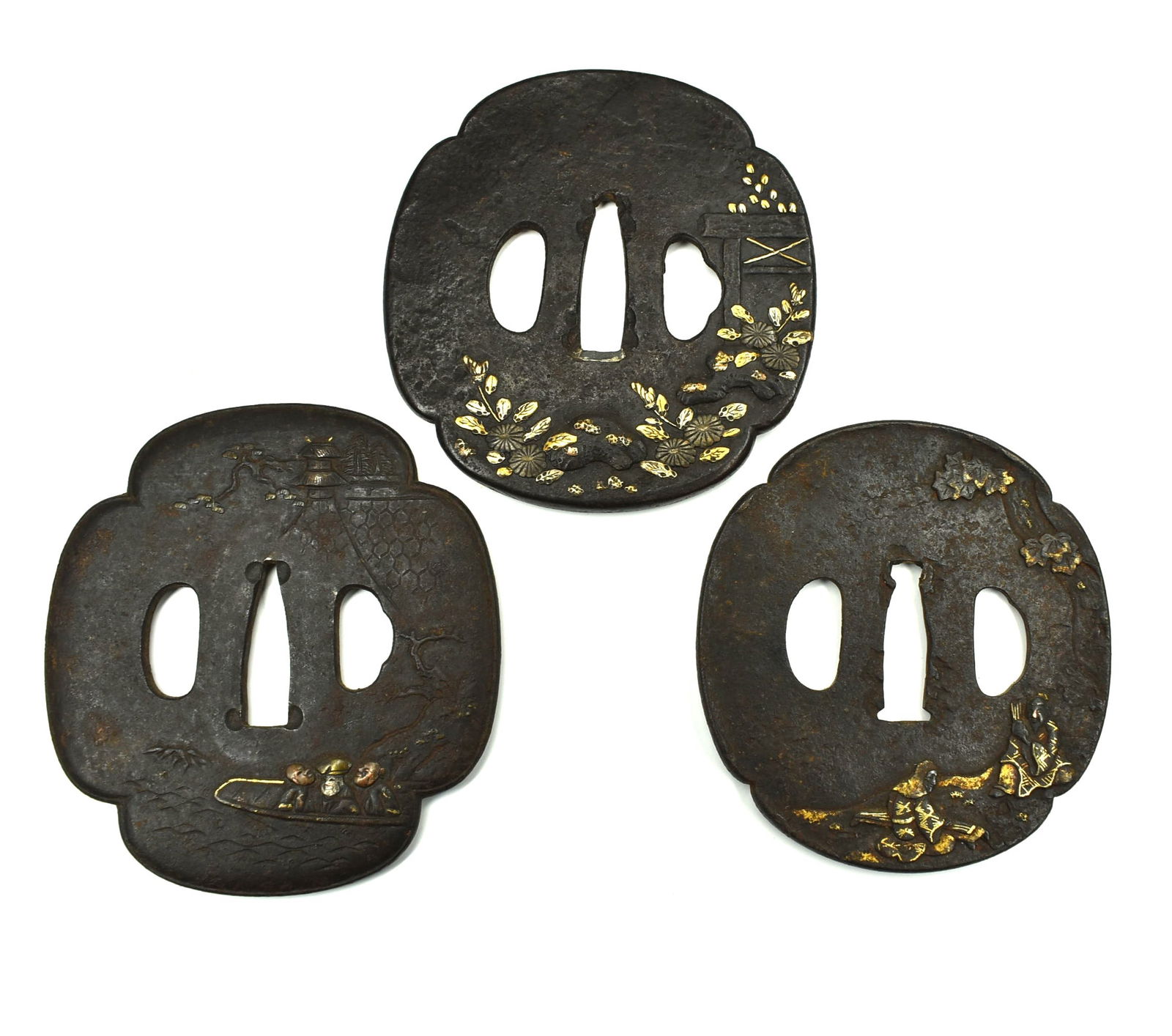 A grouping of three Edo period iron and mixed metals Tsubas (1 of 5)