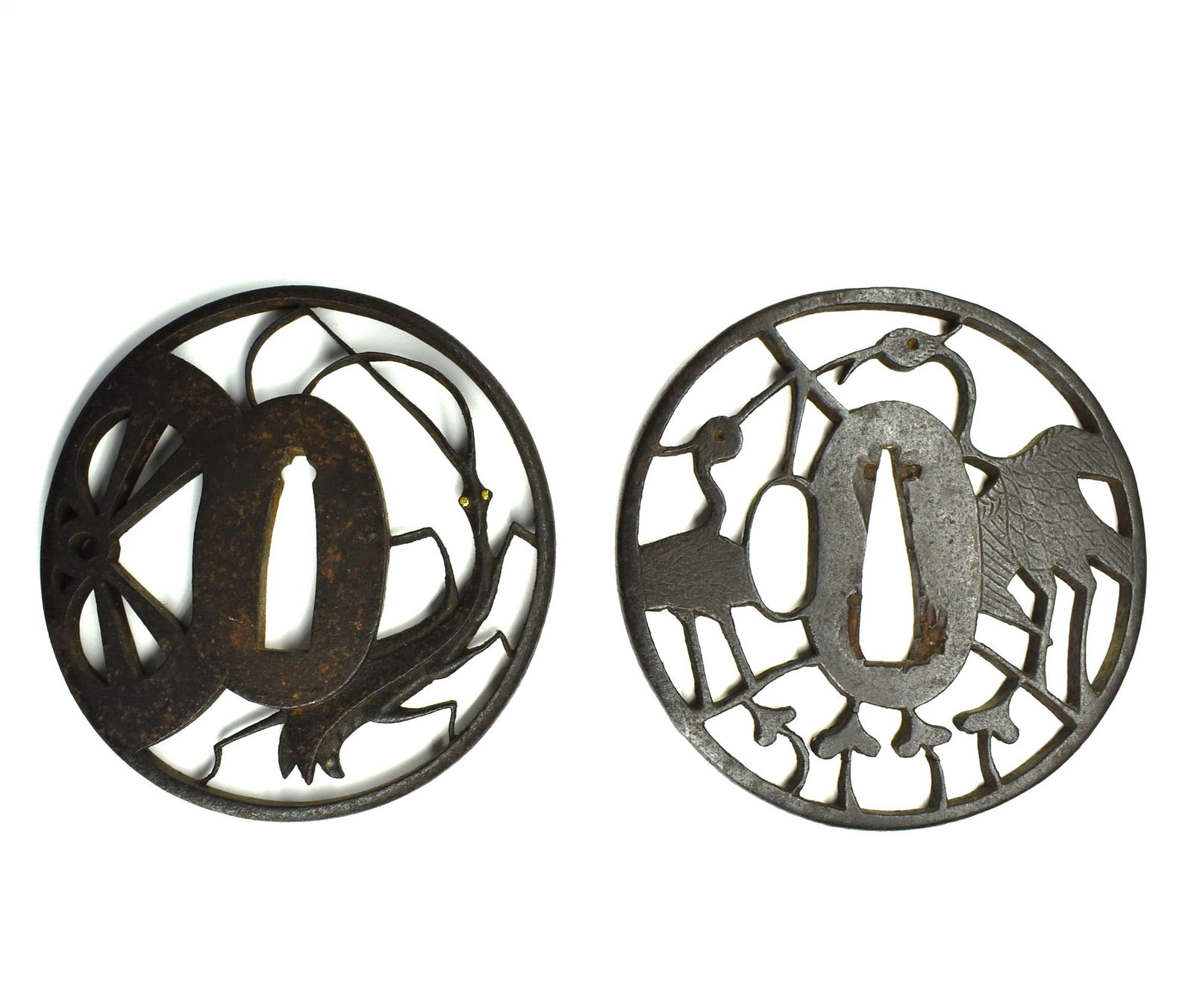 A grouping of two Edo period iron tsubas, praying mantis & wheel and crane (1 of 5)