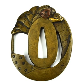 An unusual small brass Tsuba with monk