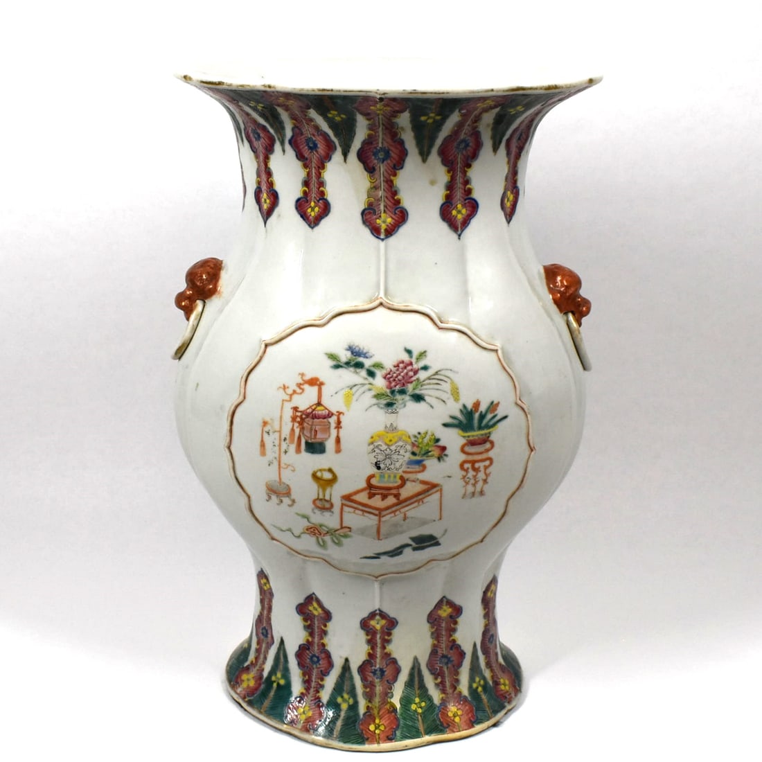 Large Chinese famille Rose vase, Qing Dynasty: A large Chinese famille rose vase, the bulbous body flanked by two mock-lion handles, the everted rim with scalopped edge, the front and back of the vase with applied cartouches, one enamel decorated 