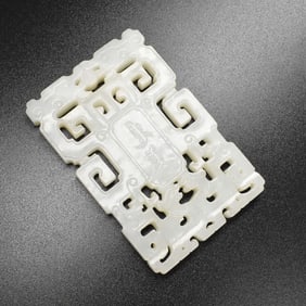 A Chinese russet and white jade reticulated plaque